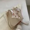 Nuevo bolso de hombro a la moda para mujer, bolso tipo cubo con cadena de cinta de gran capacidad, bolso cruzado para desplazamientos diarios