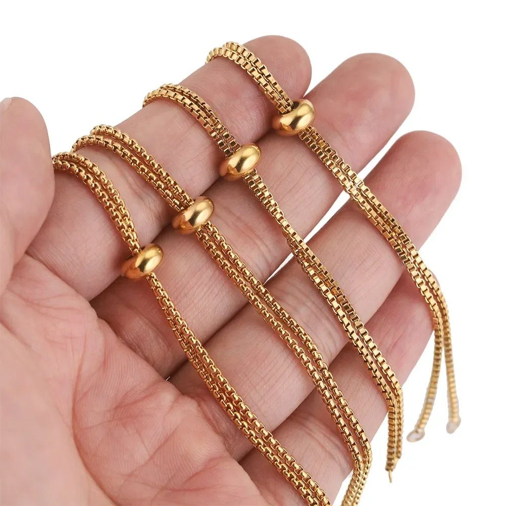 Elegant Gold-Toned Stainless Steel Slide Bracelets with Rubber Bead Accents - Set of 3