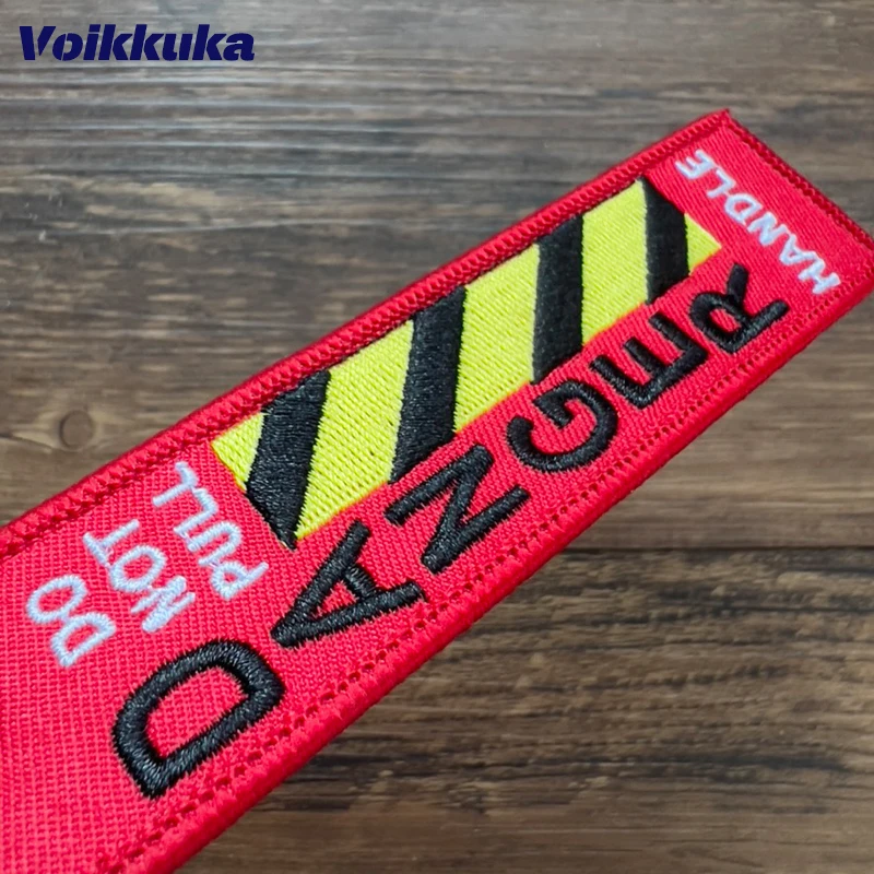 1 pz 2 pz 3 pz Set vendita entrambi i lati ricamo non tirare pericolo linea di avvertimento Red Tag moto aviazione portachiavi borsa accessori