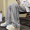 Pantalones informales con estampado de retales para hombre, pantalón holgado de pierna ancha, liso, con bolsillos, estilo americano, a la moda, para otoño