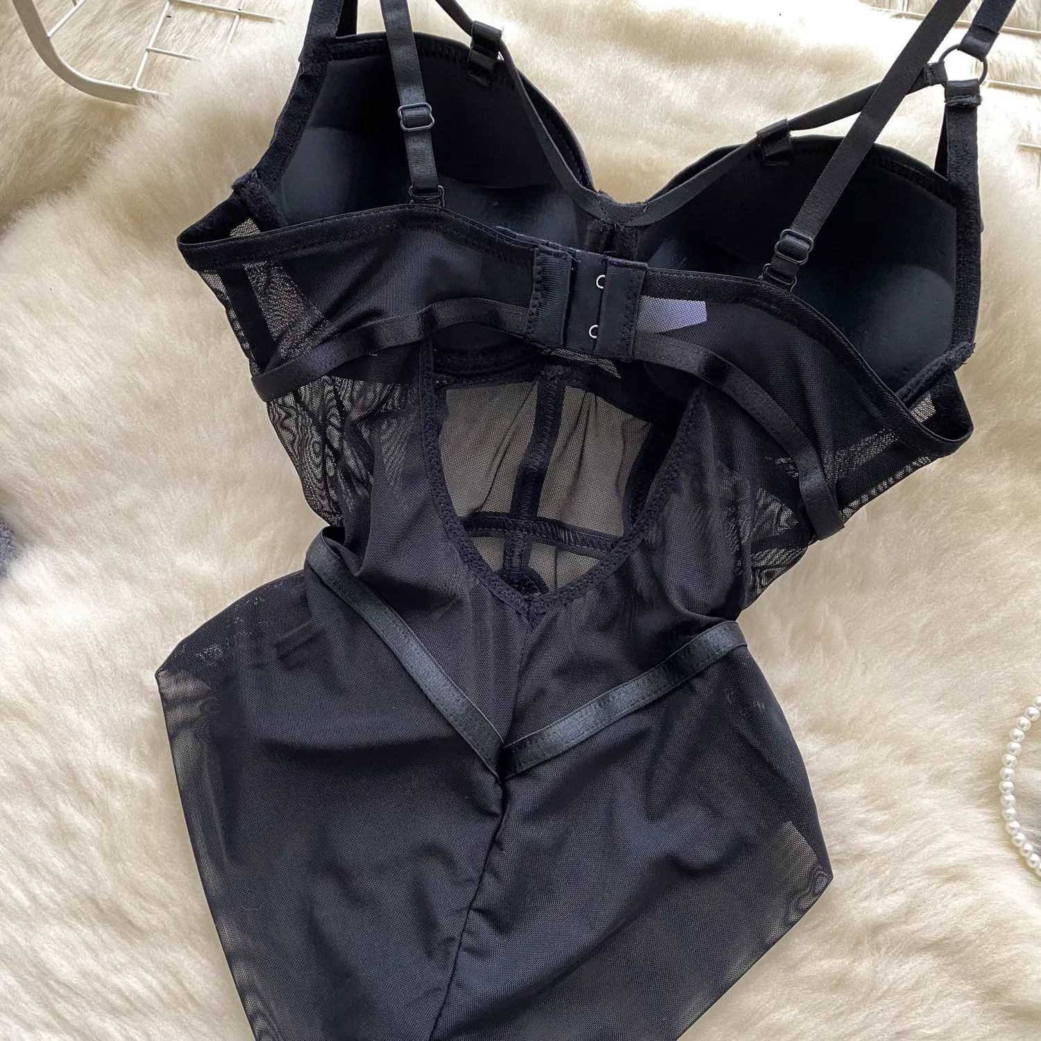 corset-inspired strap detail on bodysuit