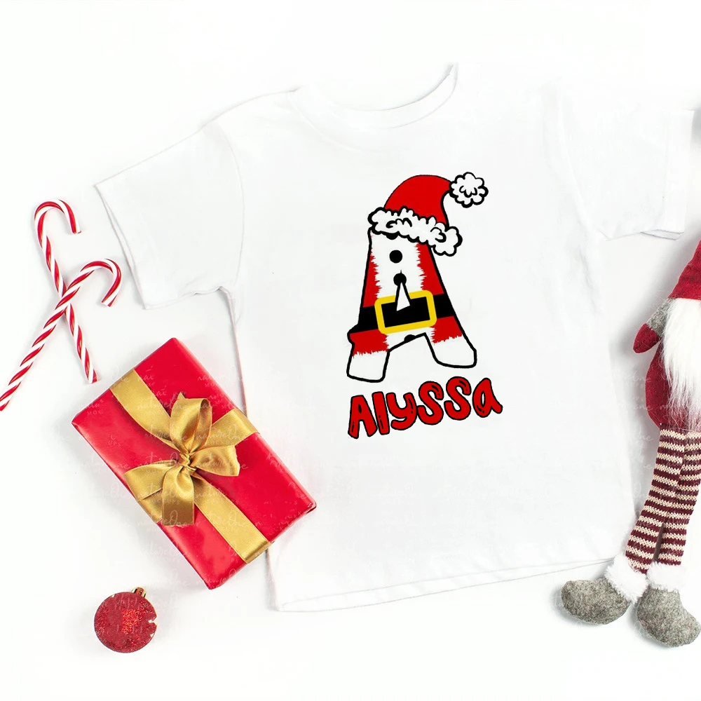thumbnail image 4 of Camiseta personalizada con inicial y nombre, camiseta navideña para niños, ropa para niños, camisetas para niños y niñas, atuendo de fiesta, regalo de vacaciones para niños, 4 of 5