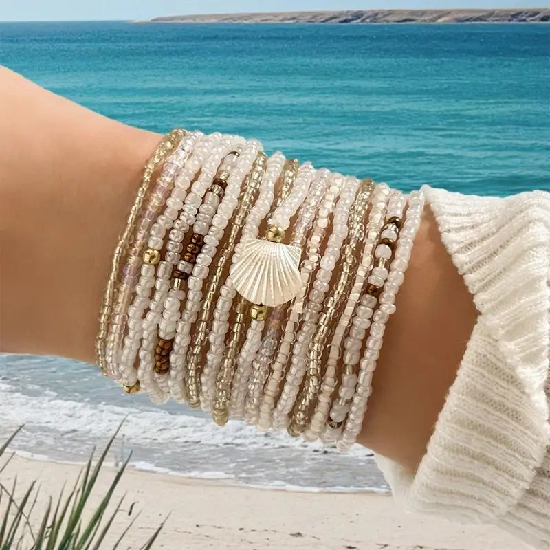 COPPIA DI BRACCIALETTI REALIZZATI A MANO CON PERLINE COLOR BRONZO E Oro