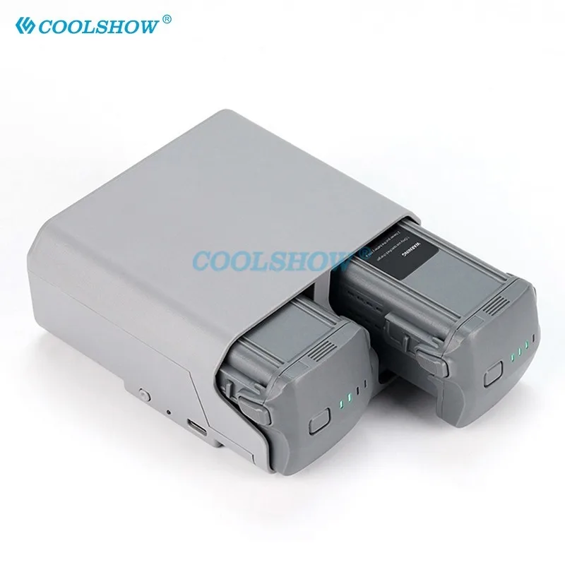 Drone DJI en vol avec batterie supplémentaire au sol - Achetez votre drone DJI pas cher lot batterie et chargeur inclus.