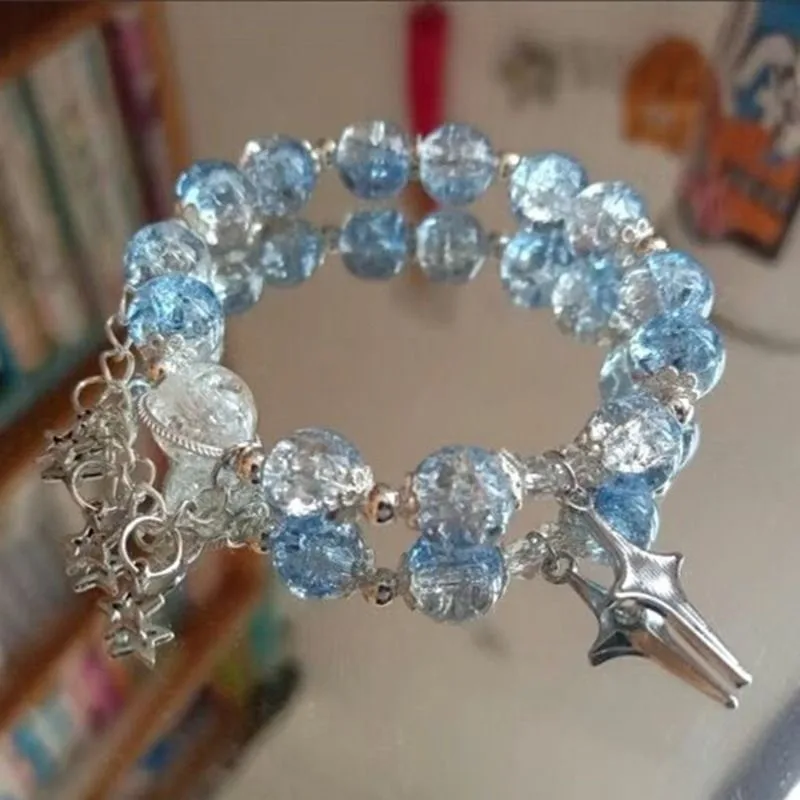 Bracciale elastico con perle cristallo blu e ciondolo a stella_voghion.com