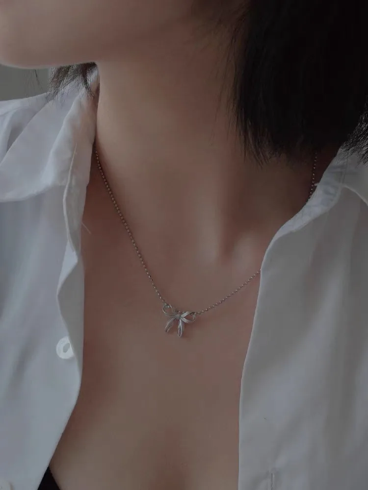 Silver Cylinder-shaped Beaded Chain with Butterfly Bowkont Charm Pendant