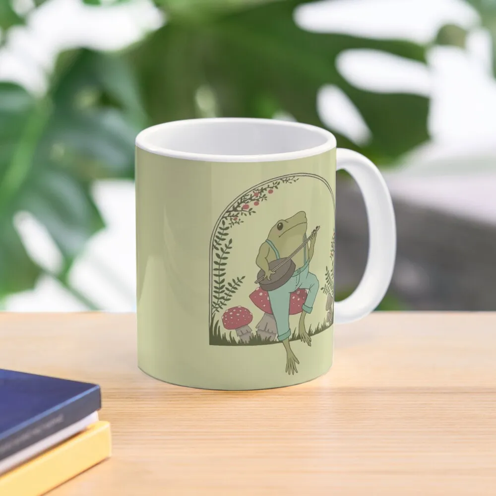 

Cottagecore Aesthetic Frog Playing Banjo on Mushroom Cute Vintage - Goblincore Farmer Toad in Garden - Dark Academia Coffee Mug