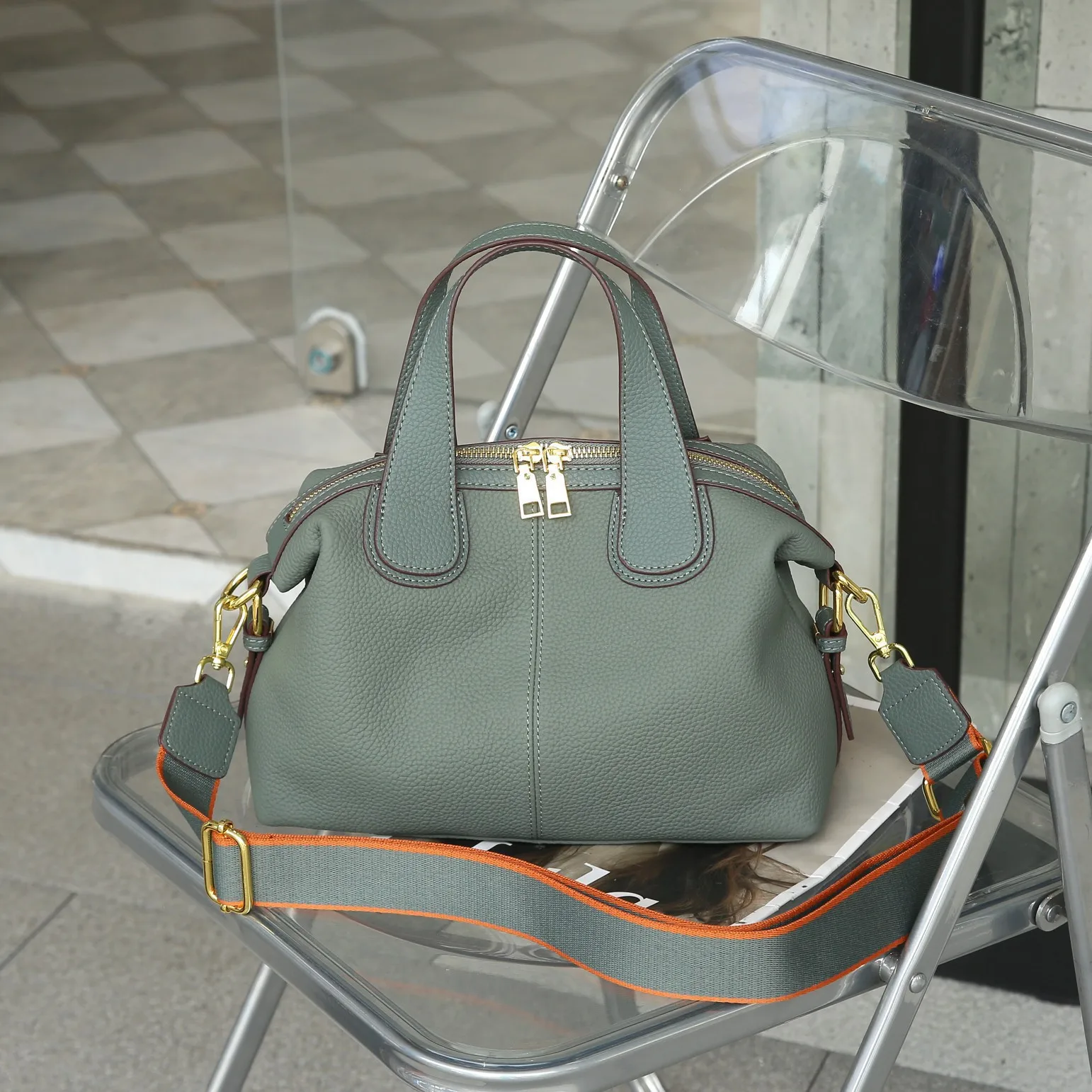 Elegant genuine leather crossbody handbag with shoulder strap and quality details