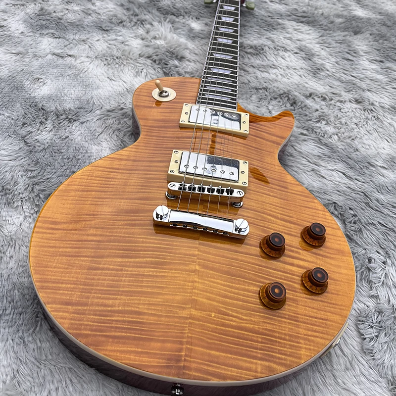 

Classic brand electric guitar, selected tiger skin veneer, peach blossom core xylophone body, free delivery home.