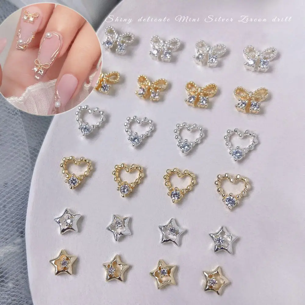 

2Pcs Love Heart Bowknot Gold Color Zircon Nail Jewelry Stars Nail Art Decorations Hollow Nail Drills Bow Nail Art Rhinestones