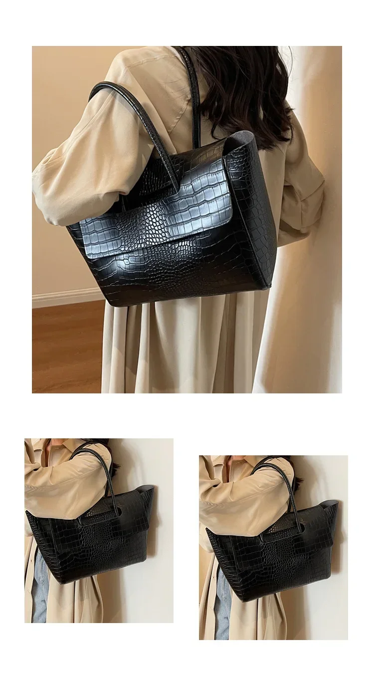 Carauana Crocodile Leather Handbag being held by short handle