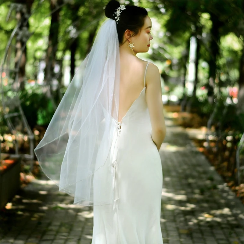 https://ae01.alicdn.com/kf/Sec8a7774b0424b6d99141576a9aabcc8x/1-Tier-Wedding-Bridal-Veil-with-Comb-Sparkling-Tube-Beads-Adornment-Edge-Short-Fingertip-Length-Cut.jpg