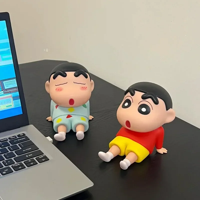 Crayon Shin-Chan Boochan phone holder displayed on a desk