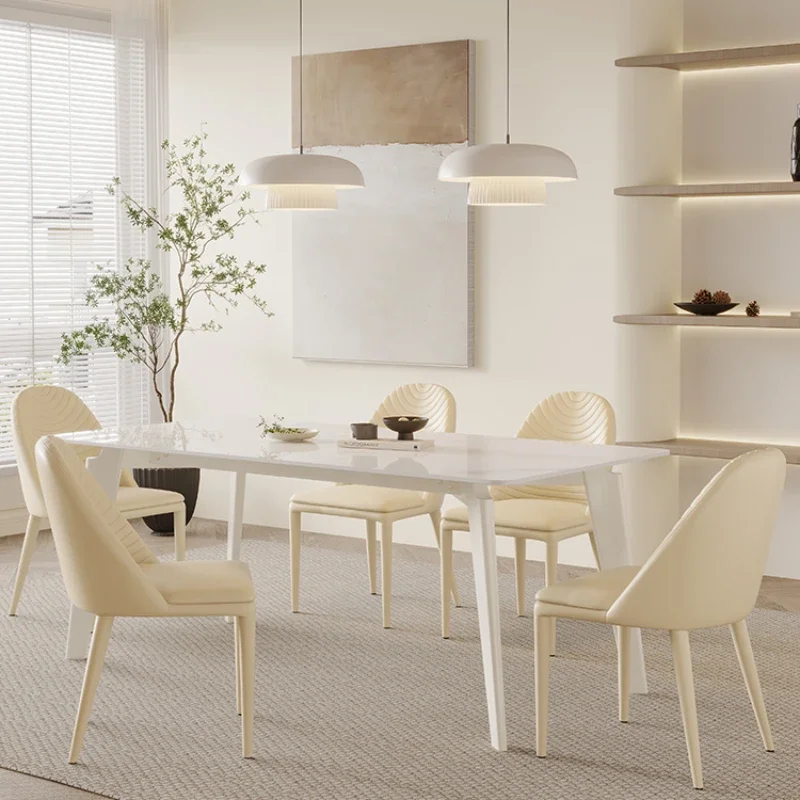 

Modern simple pure white dining table and chair combination household small apartment new cream wind to eat.