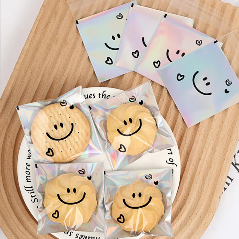 100 Stück süßes lächelndes Gesicht selbstklebende Tasche Laser transparente Keksbeutel Keksverpackungsbeutel Geburtstagsfeier Babyparty