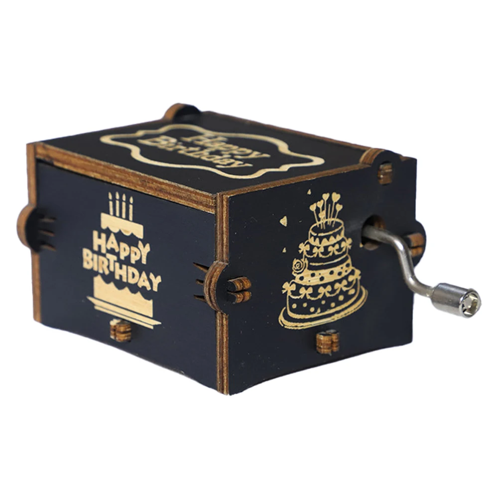 A small black Happy Birthday Music Box with "Happy Birthday" printed on it and images of a birthday cake. This charming wooden music box features a hand-crank mechanism on the side, making it the perfect birthday gift.