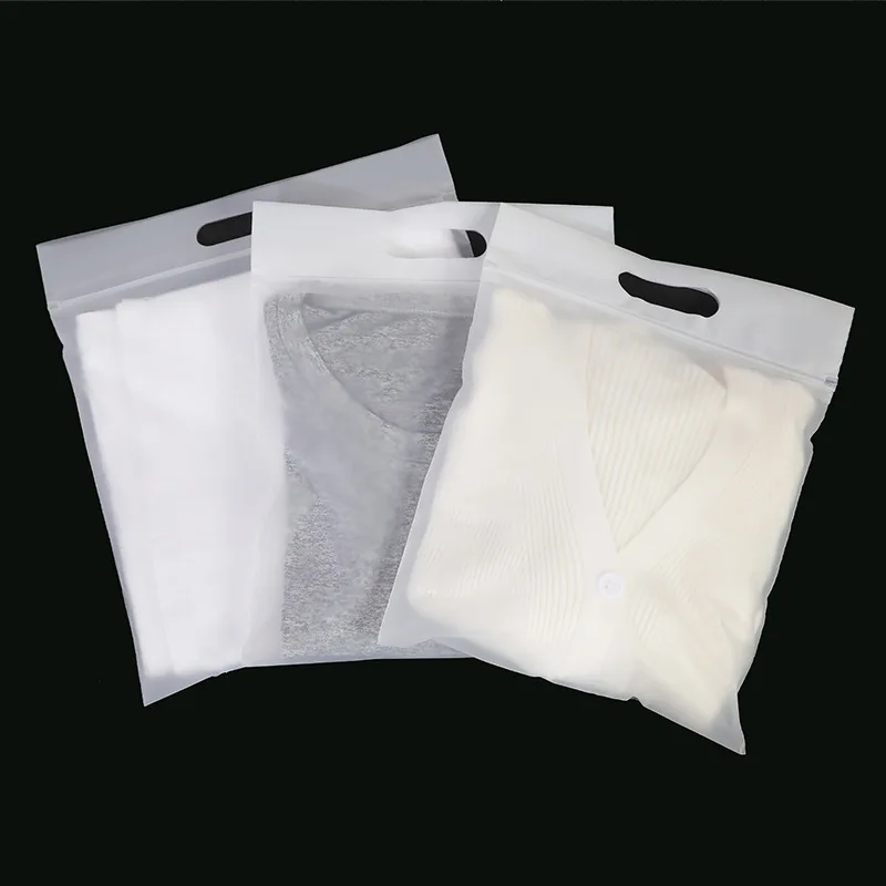 https://ae01.alicdn.com/kf/Sed0a265af8944fee9e2bc8ab7b6fcaccZ/StoBag-50pcs-Frosted-Transparent-Clothes-Packaging-Ziplock-Zipper-Bags-Tote-Handle-Plastic-Sealed-Storage-Reusable-Wholesale.jpg