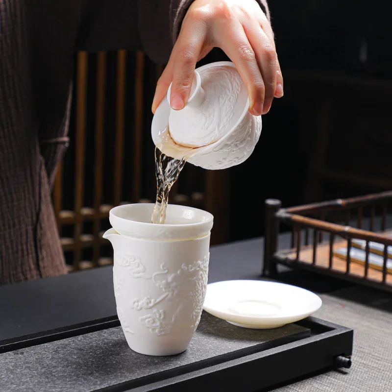 White Porcelain Kung Fu Tea Set White Jade Relief Tureen Ceramic Business Gift Simple Portable Dragon and Phoenix Cups Gaiwan tea set