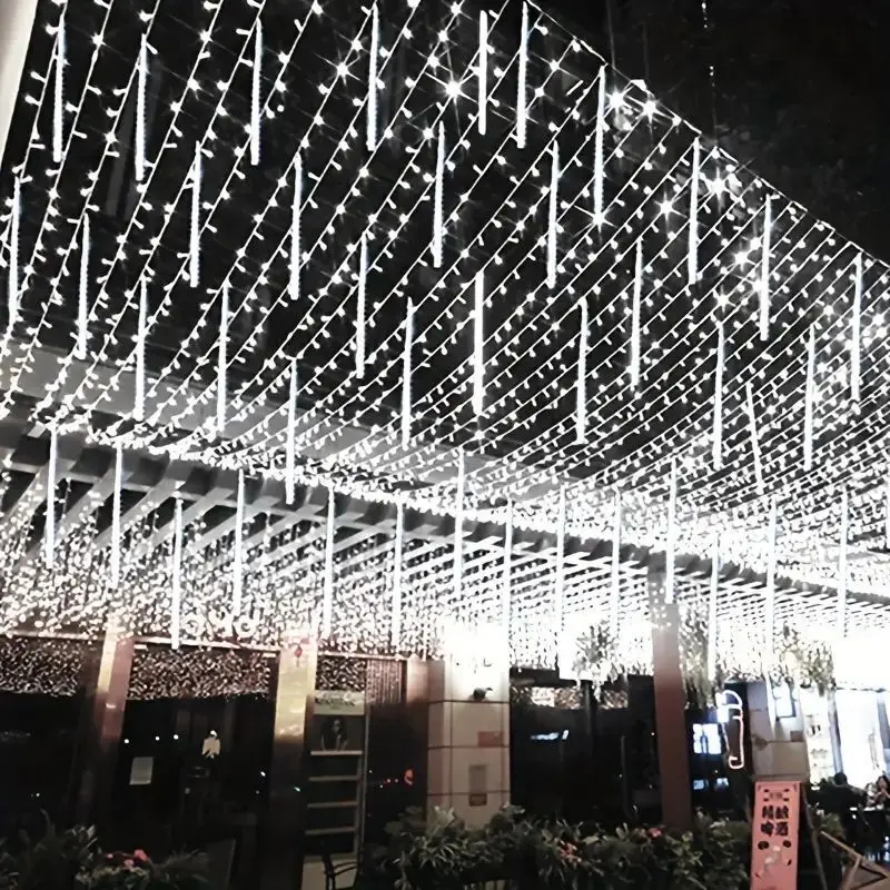 thumbnail image 1 of Cadena de luces de lluvia de meteoritos de 30 cm/50 cm, luces de carámbanos para aleros, para jardín, exterior, árbol de Navidad, decoración de bodas y fiestas, 8 tubos, 1 of 5