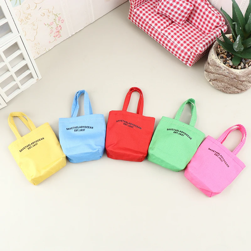 

1Pcs Dollhouse Dolls Letter Print Canvas Bags Mini Casual Shoulder Bag Handbag Doll Dress UP Toys For 1/6 Doll Decor Accessories