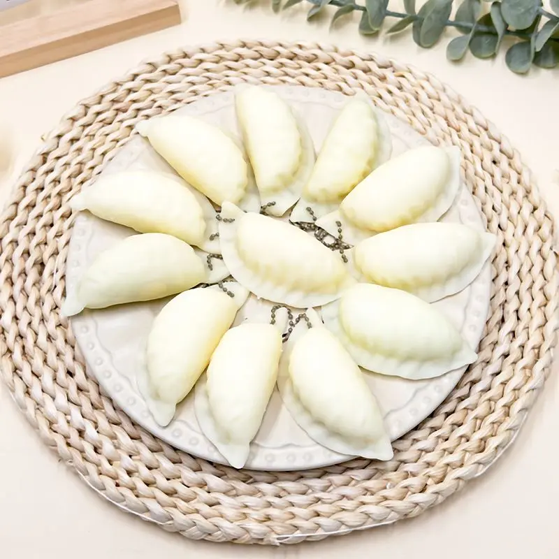 새롭고 창의적인 귀여운 사실적인 만두 모양의 느린 반응의 부드러운 스퀴즈 스트레스 해소 장난감 소품 학생 재미있는 선물 키체인 장난감 선물