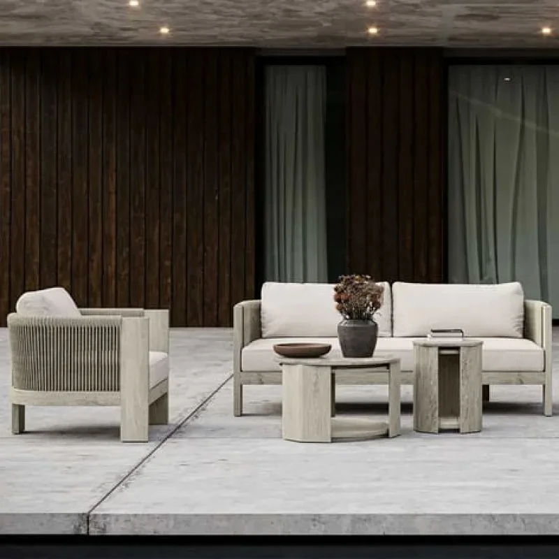 Outdoor garden armchair made of teak wood and woven acrylic, the fabric used for the cushions is waterproof and UV resistant.