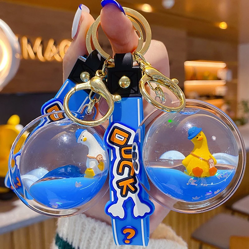 漫画アクリルボールにオイルフローティング傾いアヒル液体キーホルダー