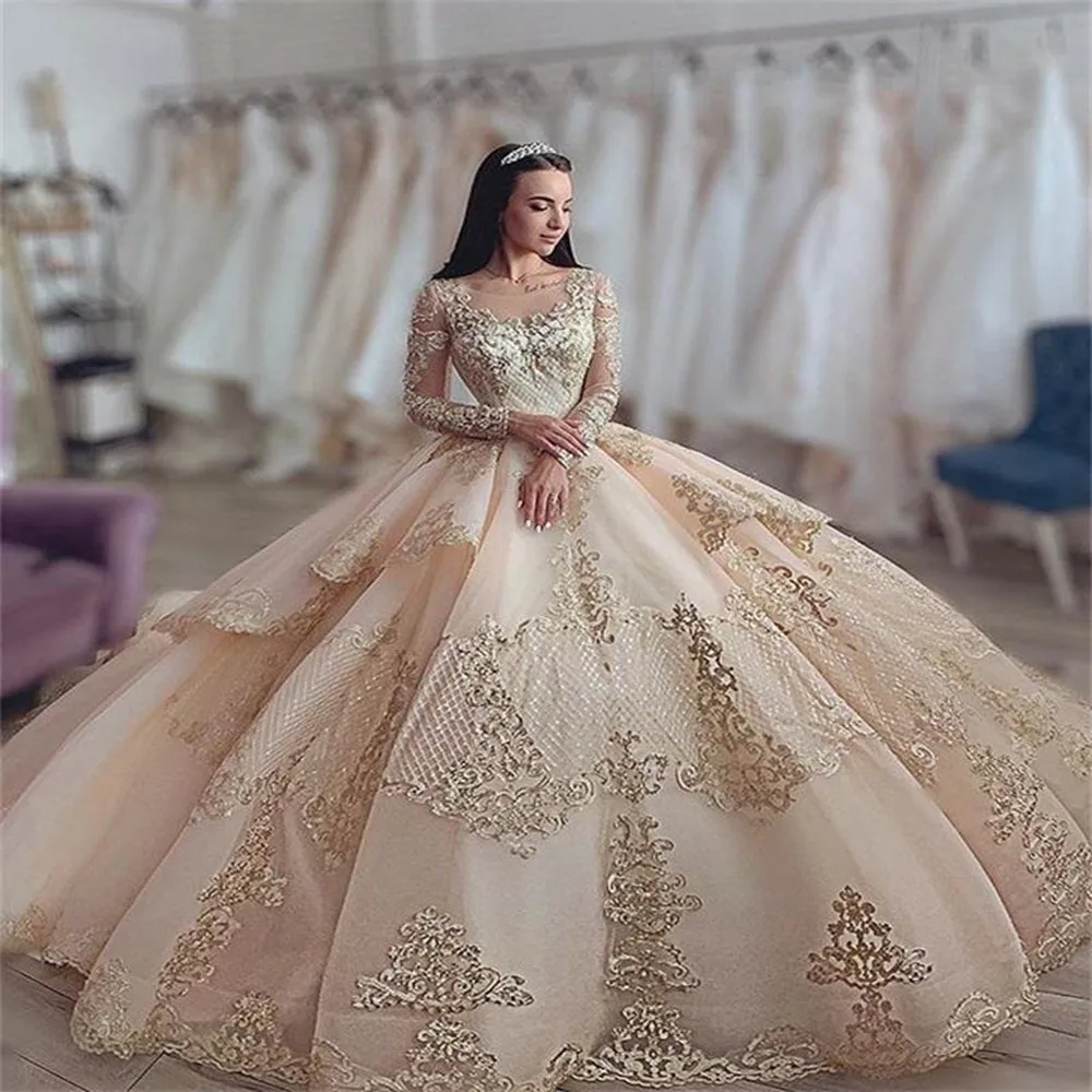 

Luxury Champagne Quinceanera Dresses 2024 Lace Appliqued Crystal Long Sleeve Ball Gown vestidos de primera comunion para niña