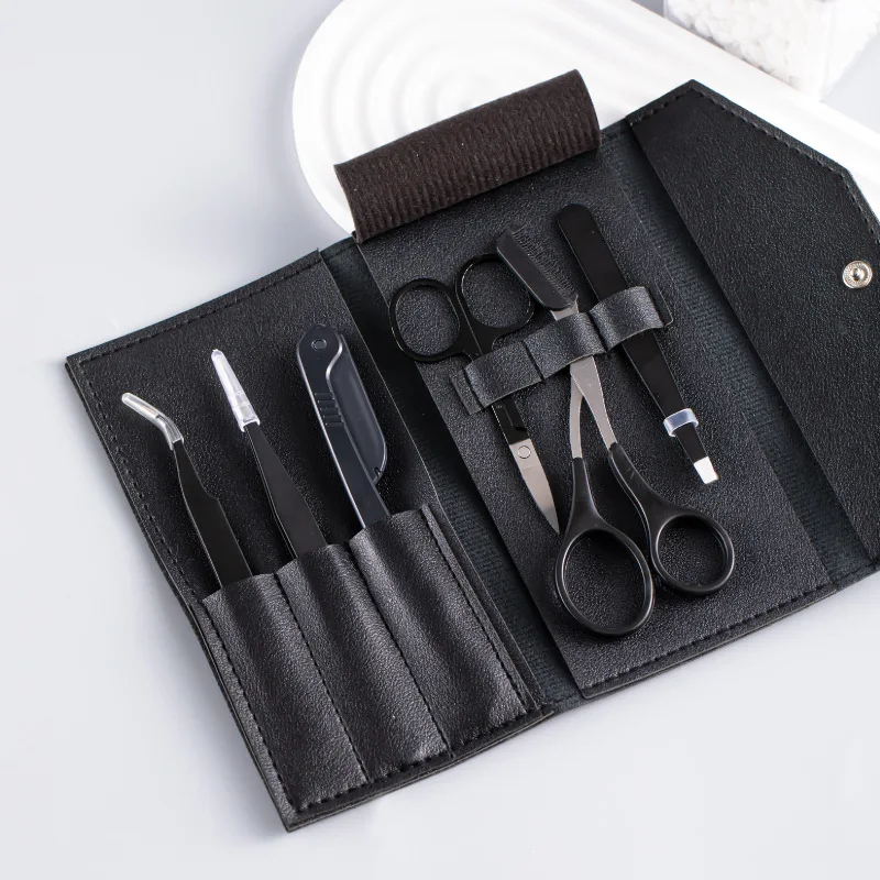 Eyebrow trimming set including eyebrow scissors, eyebrow trimmer, tweezers, false eyelash applicator, and a storage pouch eyebrow trimmer set