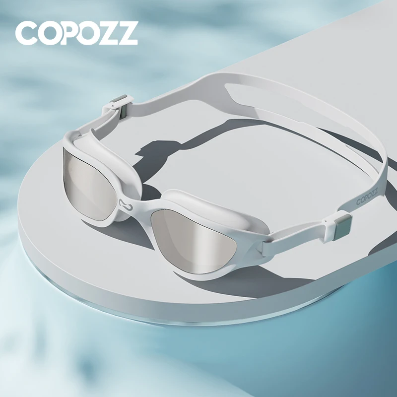 Lunettes de natation COPOZZ anti-buée UV professionnelles - Vision claire ajustable pour adultes