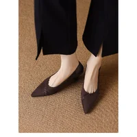 Dark Brown Pointed Toe Kitten Heel Pumps with Trousers Dark brown pointed toe kitten heel pumps worn with black trousers on beige carpet