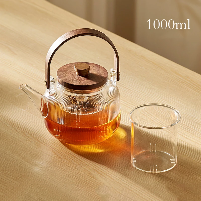 https://ae01.alicdn.com/kf/See1d22017ac048cbabc82858bf96e690F/GIANXI-Glass-Tea-Pot-With-Wooden-Handle-And-Wooden-Cover-Stainless-Steel-Filter-Steaming-Of-Tea.jpg