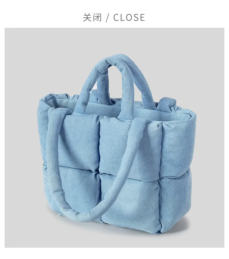 Detail of padded handle on denim puffer bag