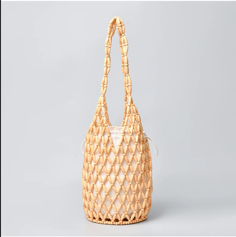 Borsa a spalla donna intrecciata con perline in legno borsa a secchiello_voghion.com