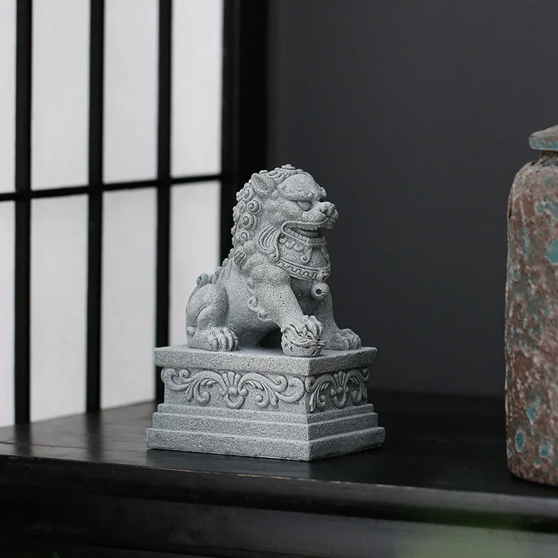 

A pair of Chinese style stone carved lion tabletop ornaments