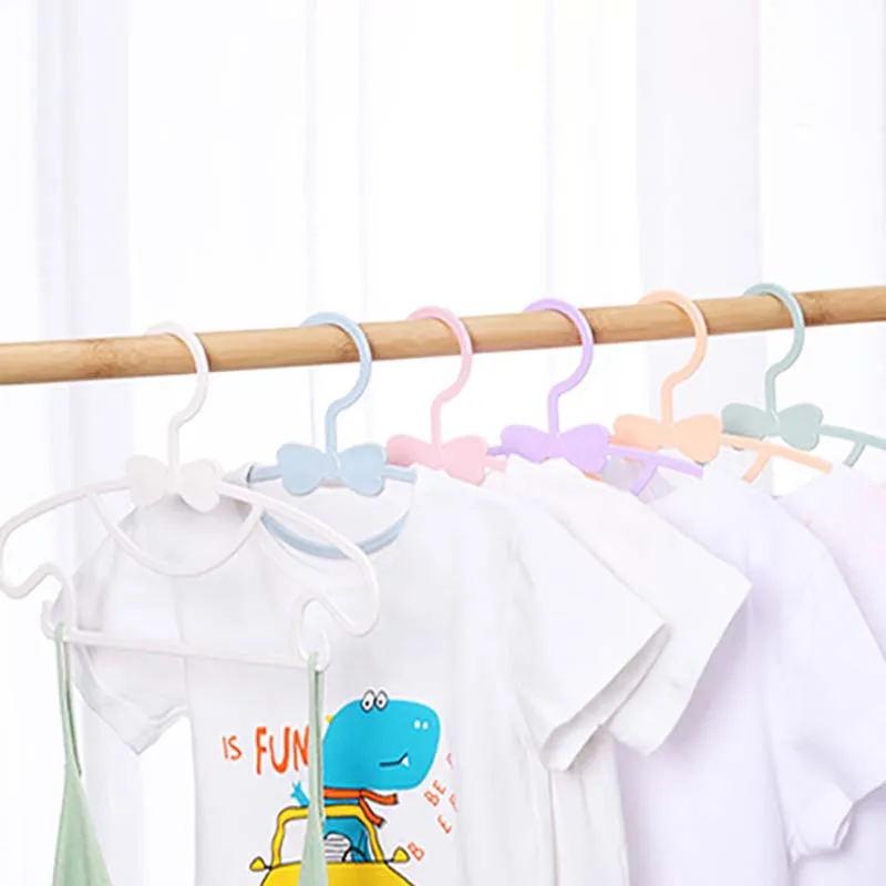 https://ae01.alicdn.com/kf/See9998328f724c78b3358c3b677f54a9C/1Pcs-Portable-Kids-Clothes-Hanger-Baby-Clothing-Organizer-Display-Hangers-Windproof-Pure-Color-Children-Coats-Racks.jpg
