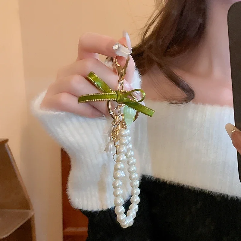 Fresh and Elegant Bell Orchid Keychain: Green Imitation Pearl and Leather Resin Alloy Accessory