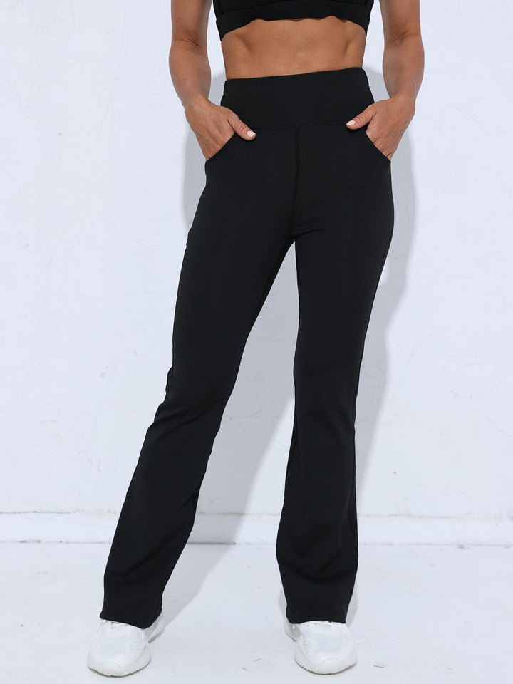 Ladies' black high waisted flared pants with pockets, the perfect choice for sports enthusiasts