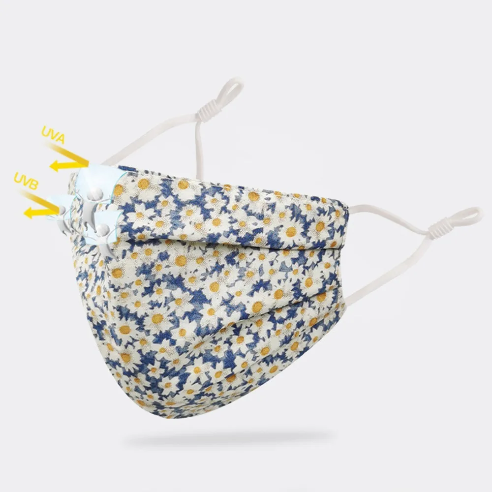 Masque réutilisable en tissu 3 couches, lavable et écologique, dans différentes couleurs disposées en rangée.
