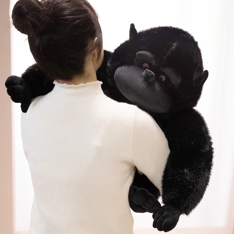 Enhance your space with the Gorilla Plush Black Throw Pillow - Decorative Zoo Souvenir