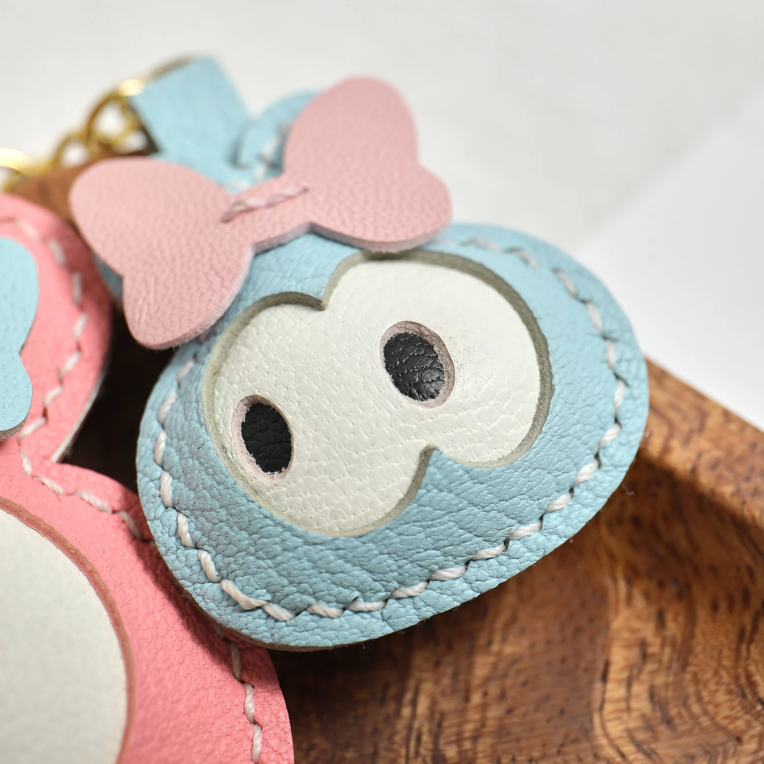 Premium goatskin leather bag charm detail