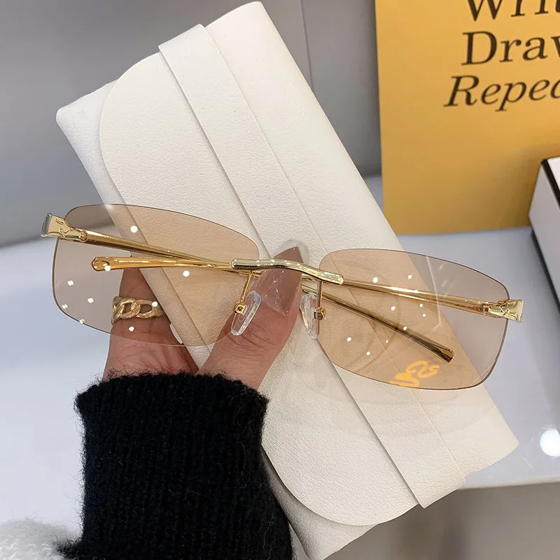 Stylish rimless rectangle sunglasses with tinted lenses and gold temples