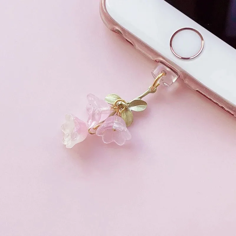 Charming Pink Lily of the Valley Phone Accessory with Green Leaf Accent