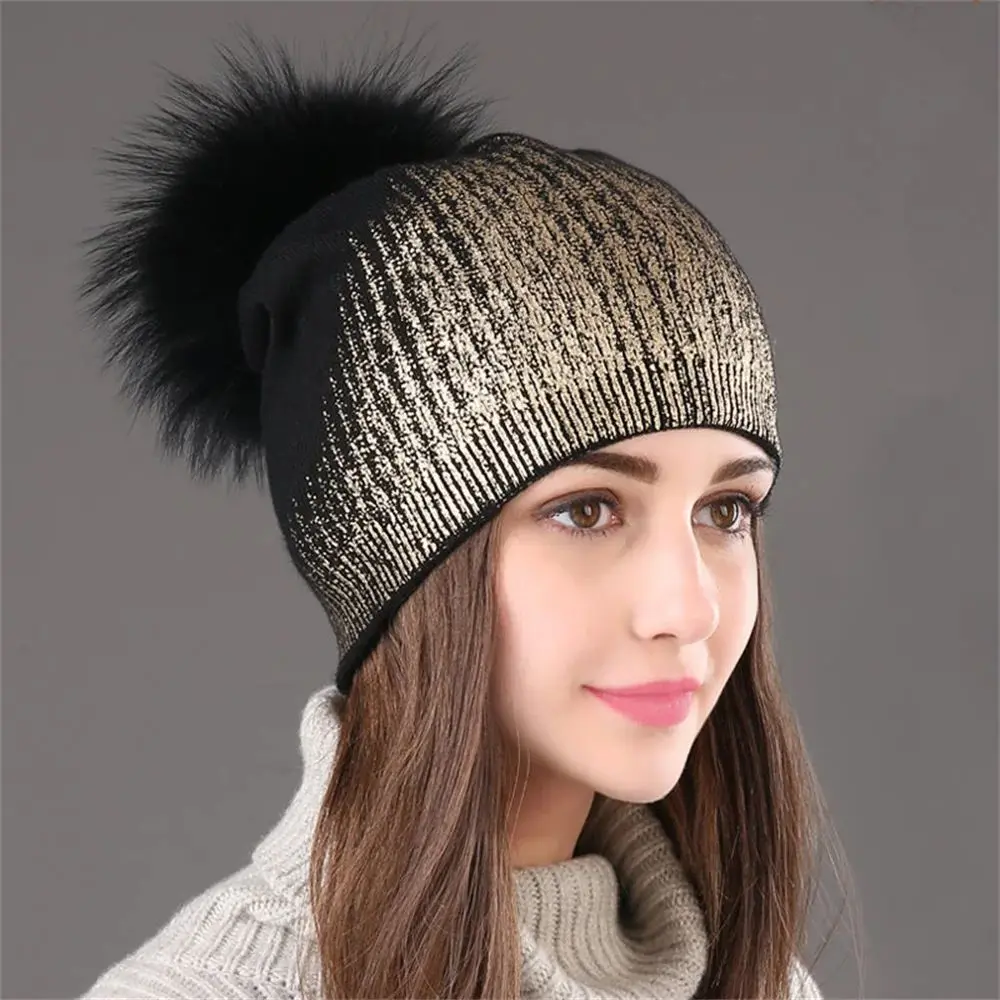 

European and American winter warm wool knitted hats women's hot gold and silver colored hats raccoon ball fur fur woolen hats