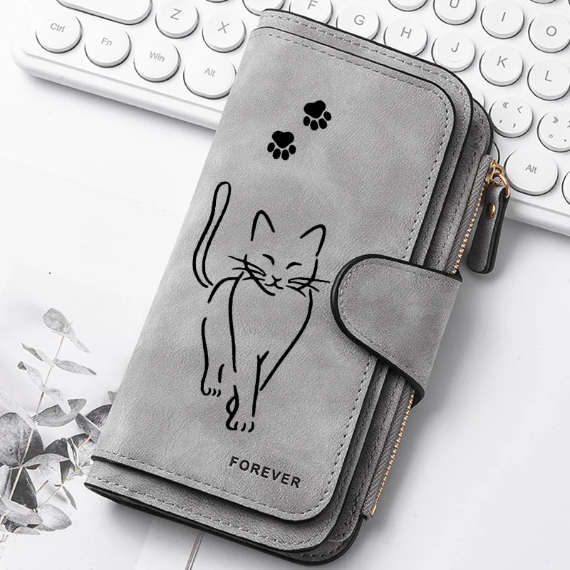 Featuring a cat motif this women's long wallet offers multiple card slots a coin pocket and a cell phone pouch A perfect gift