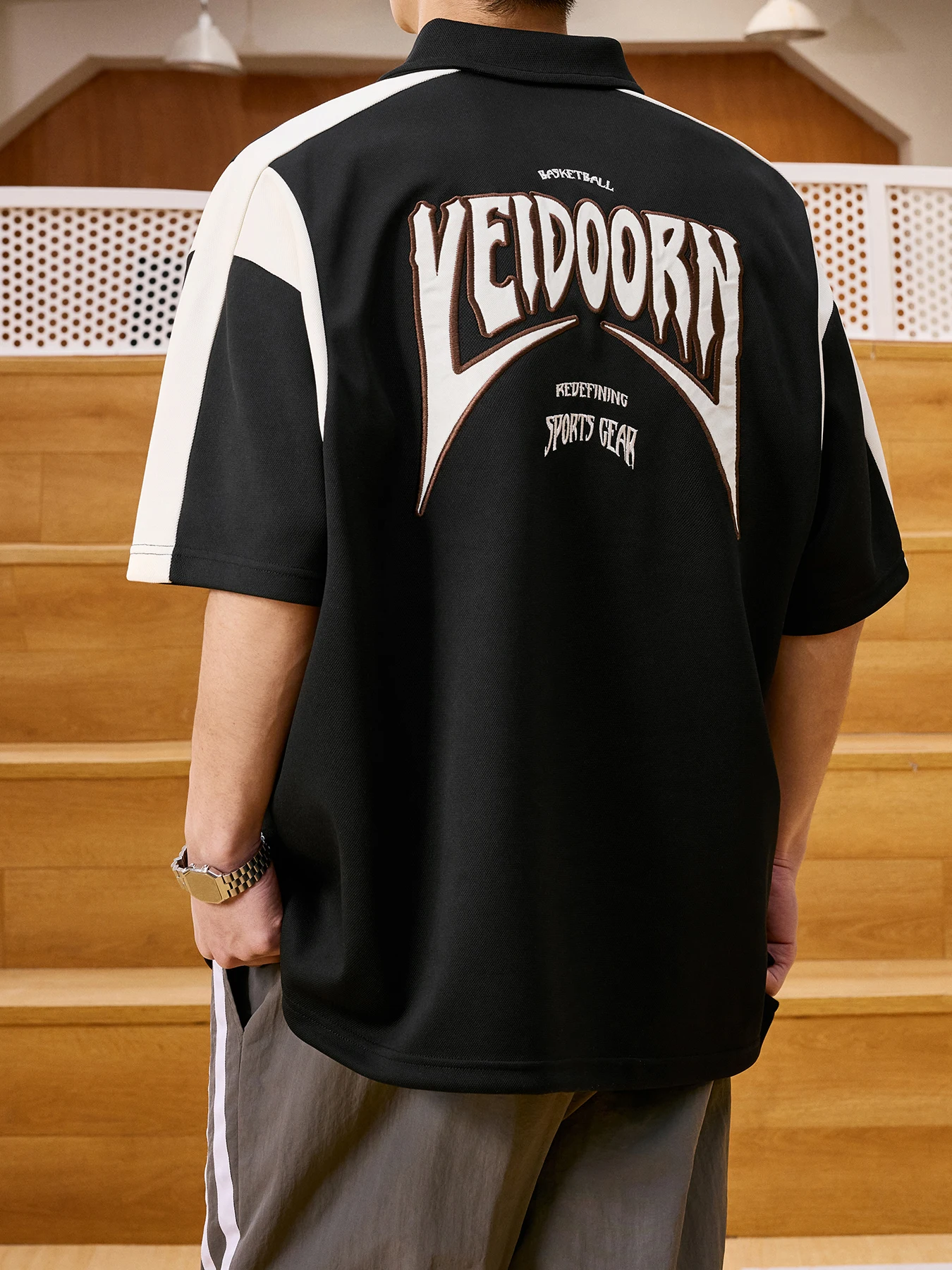 Men Wearing Black Polo Shirt