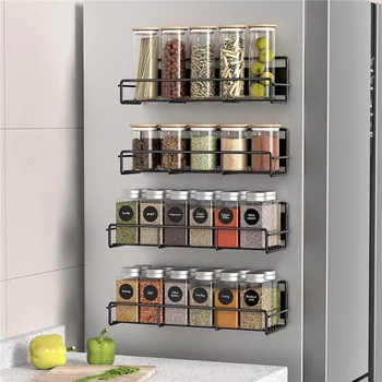 A single black metal magnetic seasoning rack attached to the side of a refrigerator, holding several minimalist spice jars.