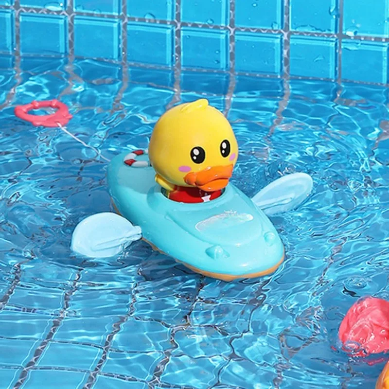 

Bath Toys For Swimming Bathtub Pool Toy Floating Ducklings Toy Manual Pull String Ducks Boat Paddler Bathtub Baby First Bath Toy
