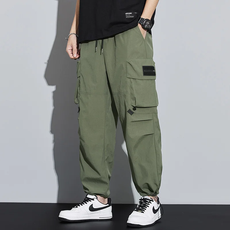 Elastic leggings for men's autumn new trend versatile large pocket waterproof casual pants for men