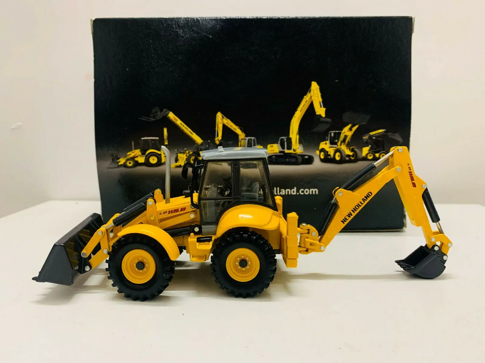 

Ros New Holland LB 115B Backhoe Loader 1:50 Scale DieCast Model New in Box